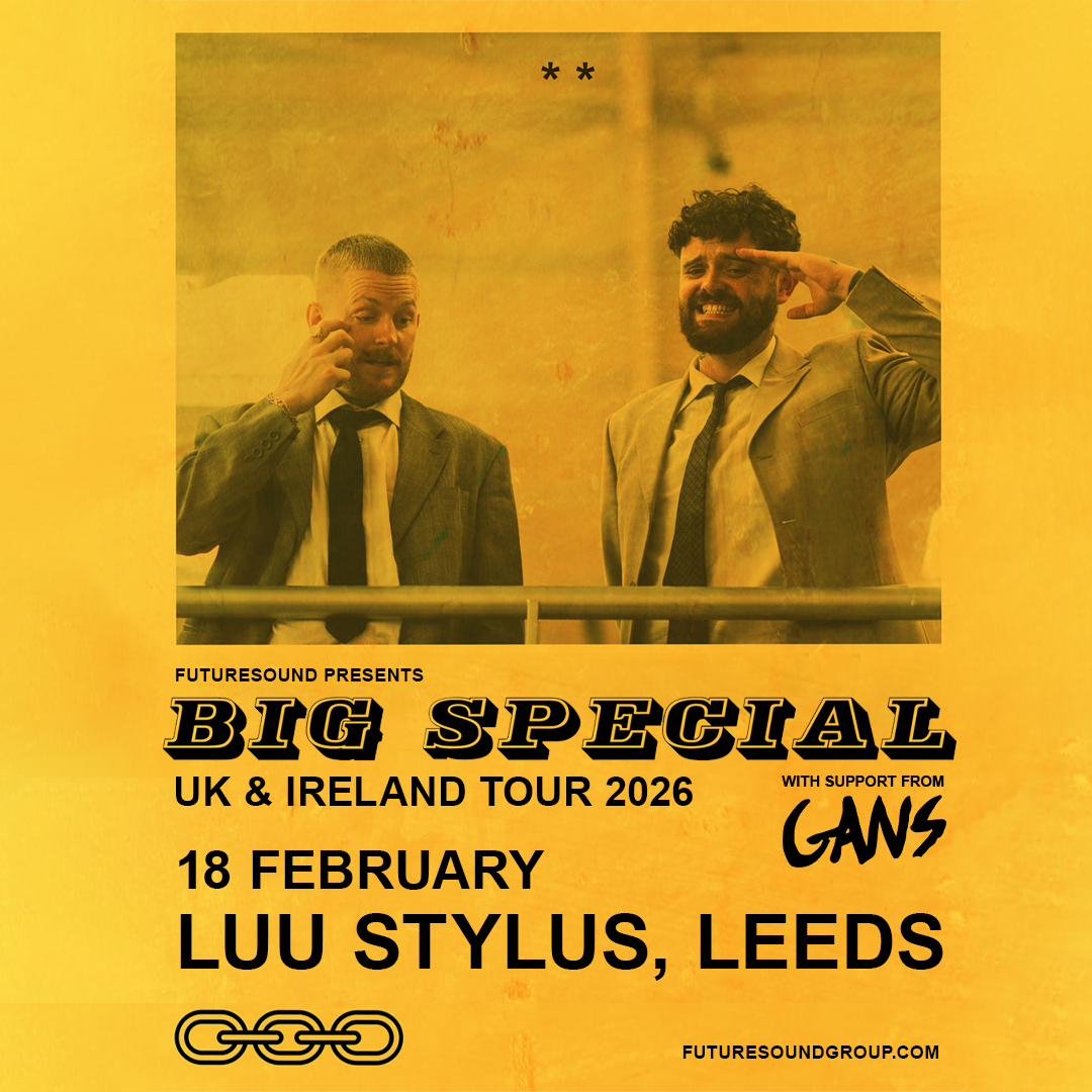 A promotional poster with a yellow-orange background for the "BIG SPECIAL UK & Ireland Tour 2026," presented by Futuresound. At the top is a photo of two men in suits, both making hand gestures near their faces—one appearing to scratch his eye, the other saluting. Below the photo, text reads: "Futuresound Presents BIG SPECIAL UK & Ireland Tour 2026 With support from GANS 18 February LUU Stylus, Leeds" At the bottom are interlocking chain graphics and the website: futuresoundgroup.com