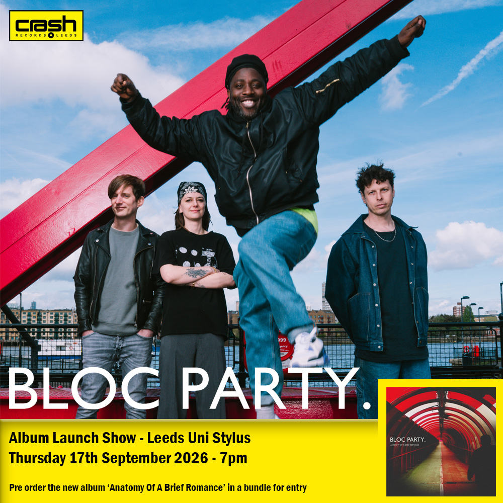 Bloc Party band members on red structure, promoting album launch show in Leeds.